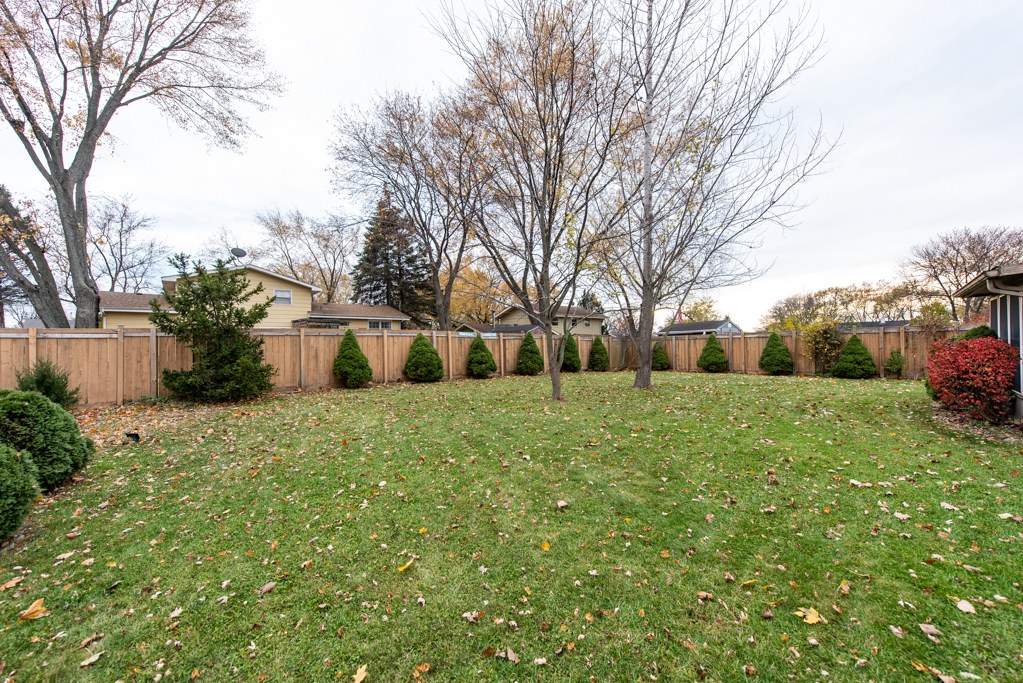2313 Beck Road Lindenhurst, IL 60046 - Photo 33 of 35 a white house that has a tree in front of it