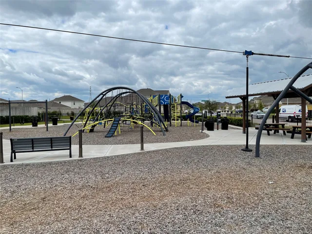 a view of a swimming pool with a bench