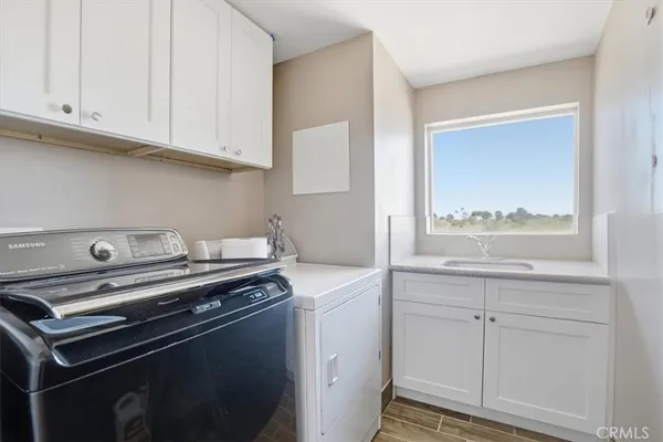 a view of a kitchen with appliances
