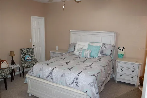 a large white bed in a white room