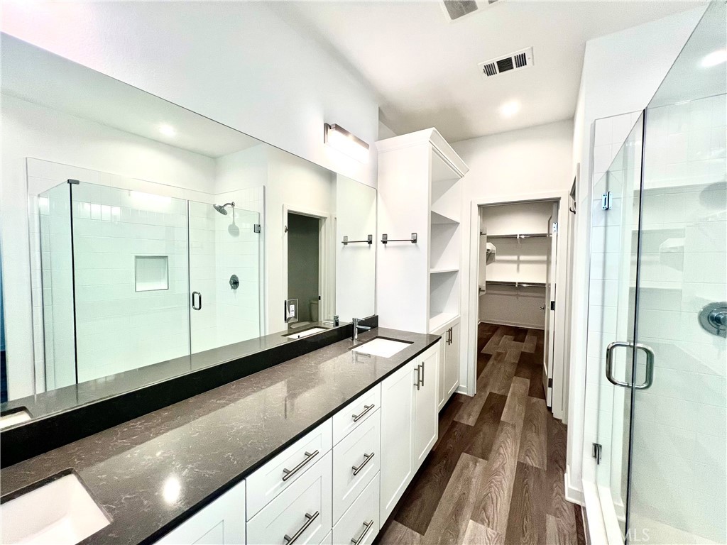 2336 Synergy Irvine, CA 92614 - Photo 15 of 24 a kitchen with stainless steel appliances granite countertop a sink and cabinets
