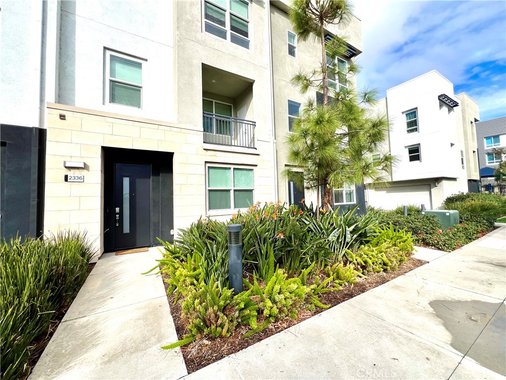 2336 Synergy Irvine, CA 92614 - Photo 2 of 24 a front view of a house with a yard