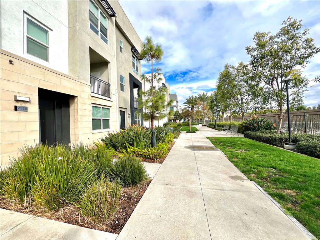 2336 Synergy Irvine, CA 92614 - Photo 3 of 24 a view of a building with a yard