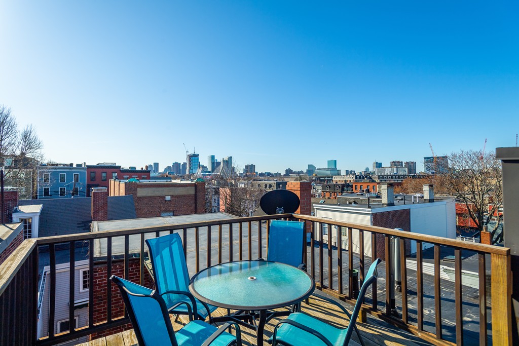 23-23A Sullivan Street, Unit 3 Boston, MA 02129 - Photo 8 of 8 a view of a balcony with a chairs