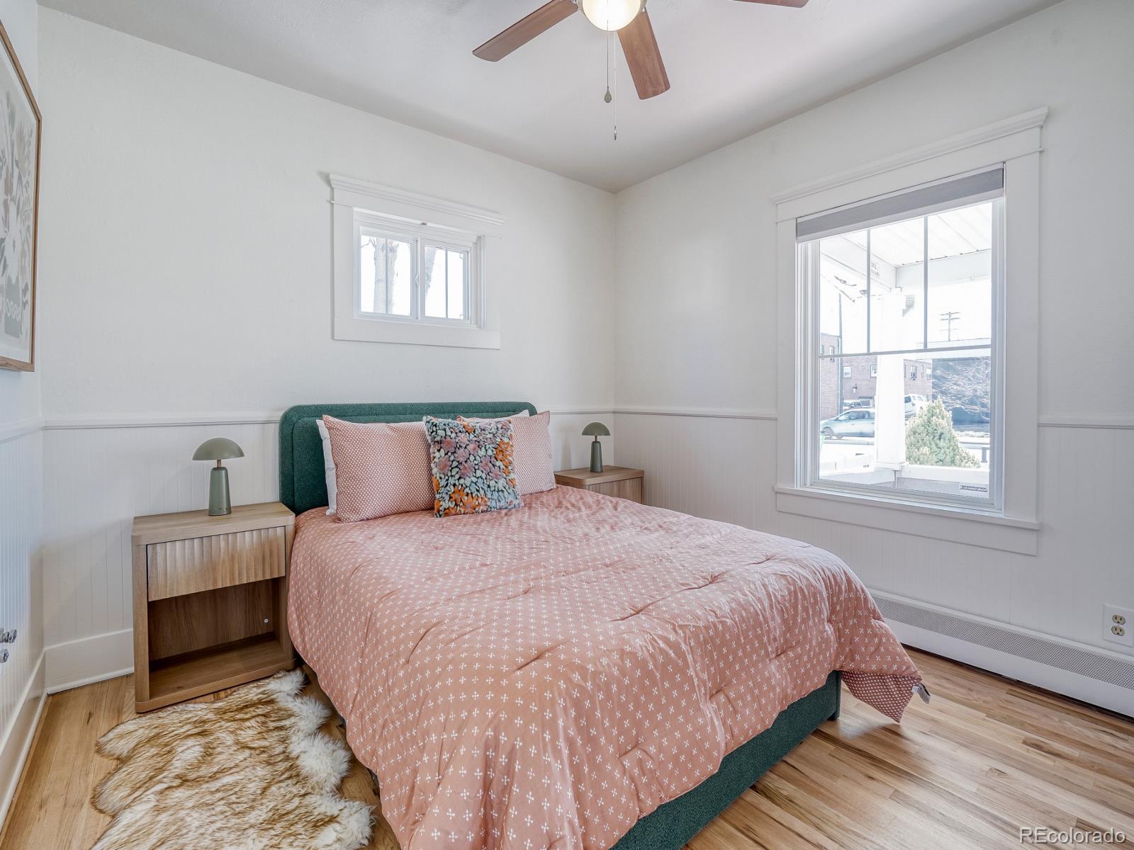 7607 Ralston Road Arvada, CO 80002 - Photo 14 of 28 a bedroom with bed and a window