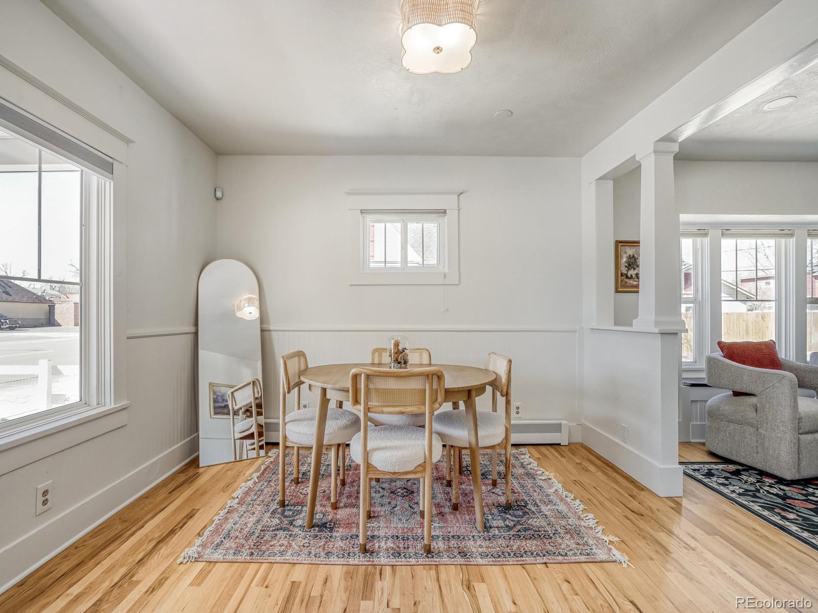 7607 Ralston Road Arvada, CO 80002 - Photo 5 of 28 a view of a dining room with furniture and wooden floor