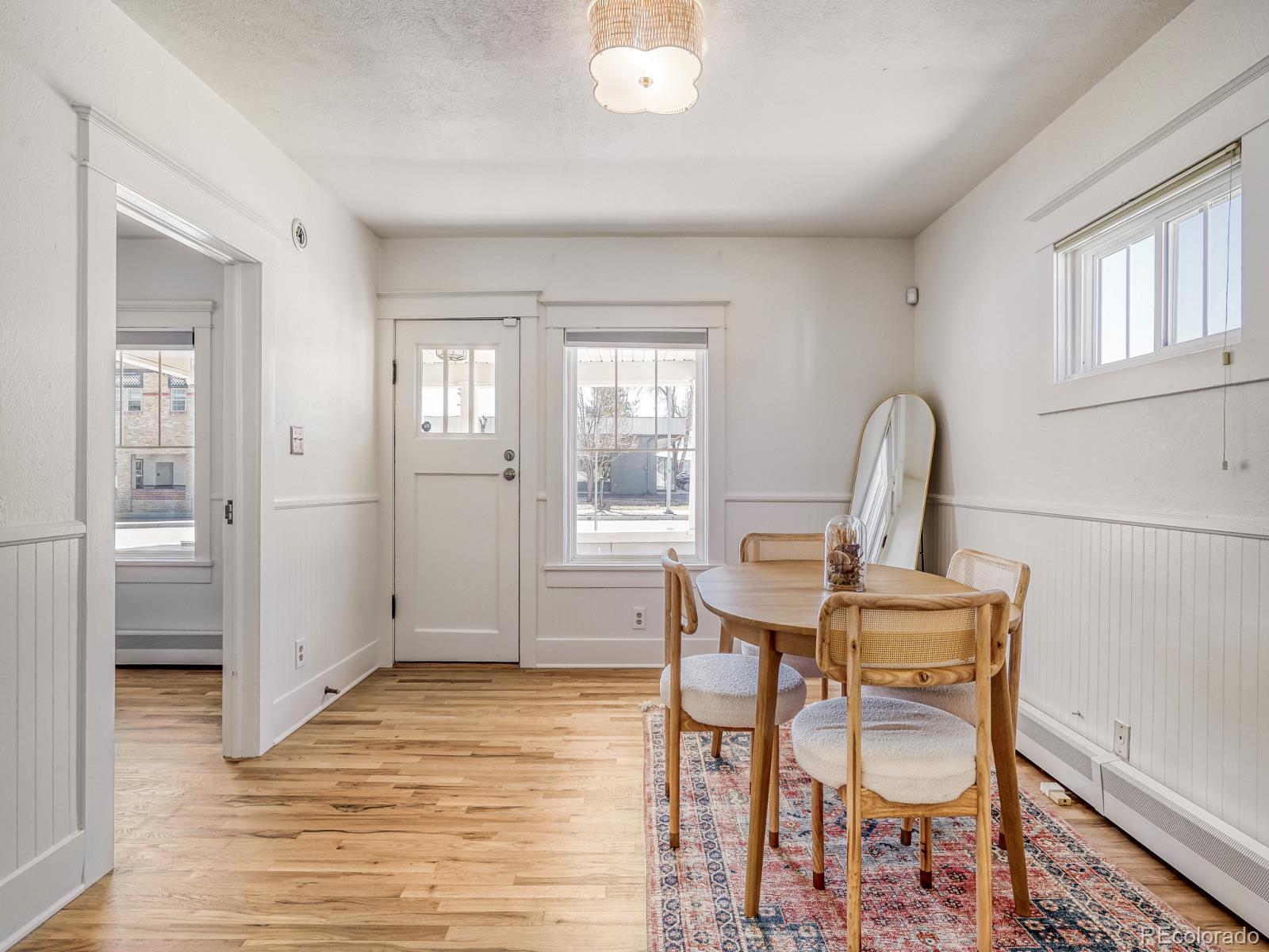 7607 Ralston Road Arvada, CO 80002 - Photo 6 of 28 a view of a room that has a window and wooden floor
