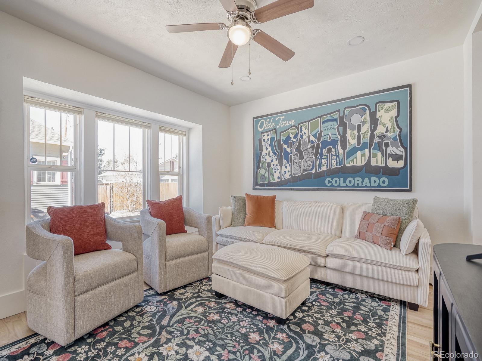 7607 Ralston Road Arvada, CO 80002 - Photo 7 of 28 a living room with furniture and a large window