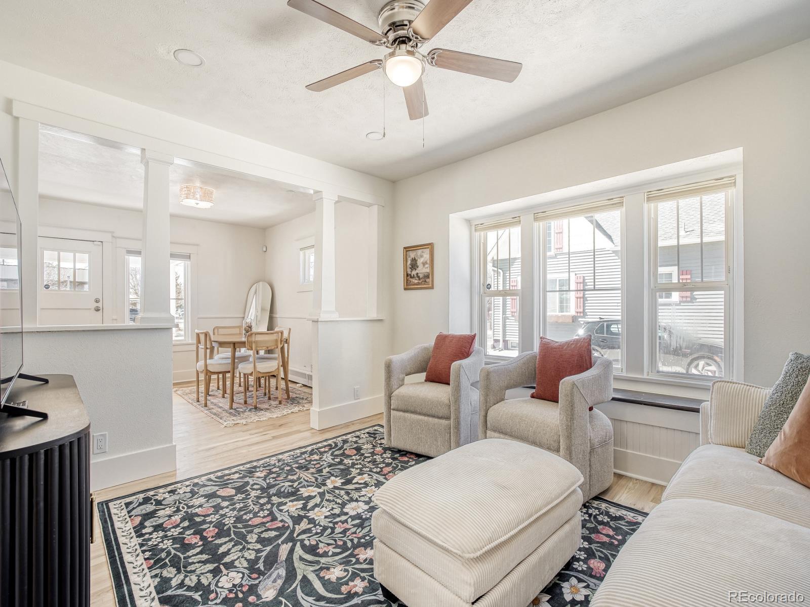 7607 Ralston Road Arvada, CO 80002 - Photo 9 of 28 a living room with furniture and a large window