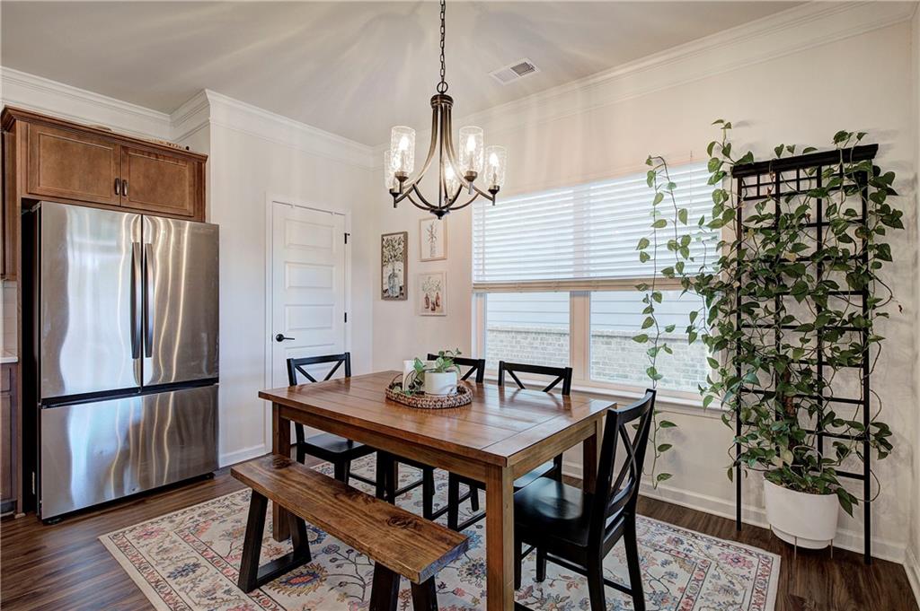402 Perth Drive Cartersville, GA 30121 - Photo 7 of 31 a view of a dining room with furniture window and wooden floor