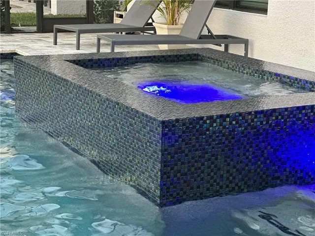 a view of a street with wooden fence