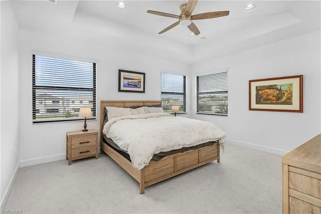 a spacious bedroom with two beds and a window