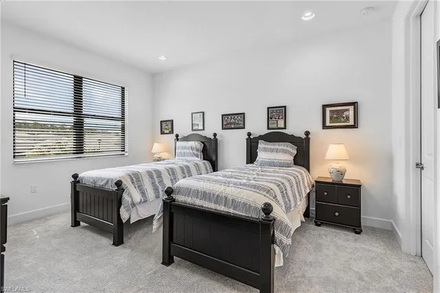 a bed room with a bed and window