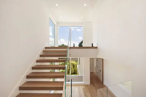 a view of an entryway with wooden floor and windows