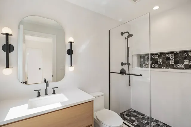 a bathroom with a sink and toilet