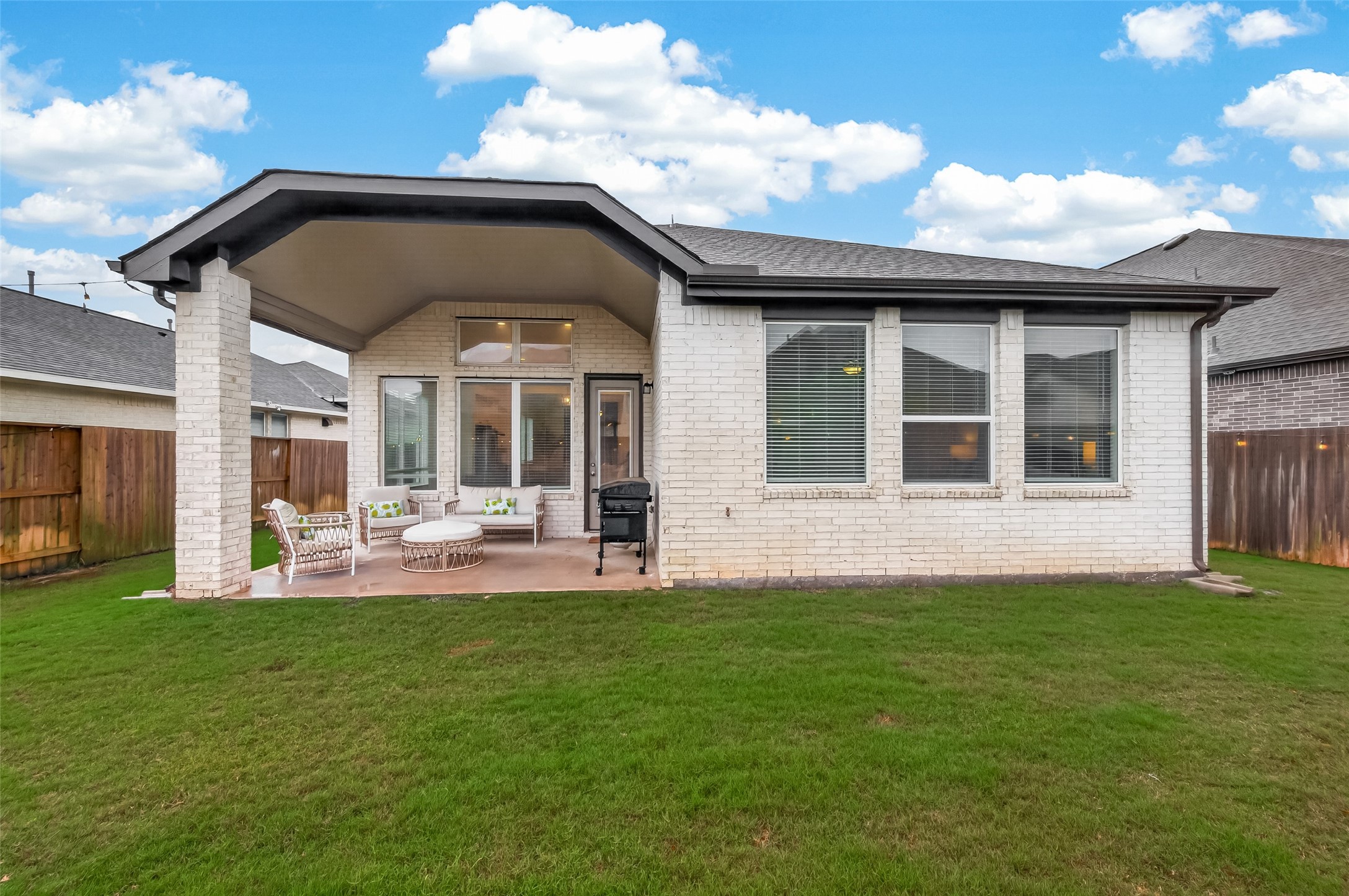 5019 Country Mdws Trail Rosharon, TX 77583 - Photo 42 of 49 a front view of a house with a garden and patio