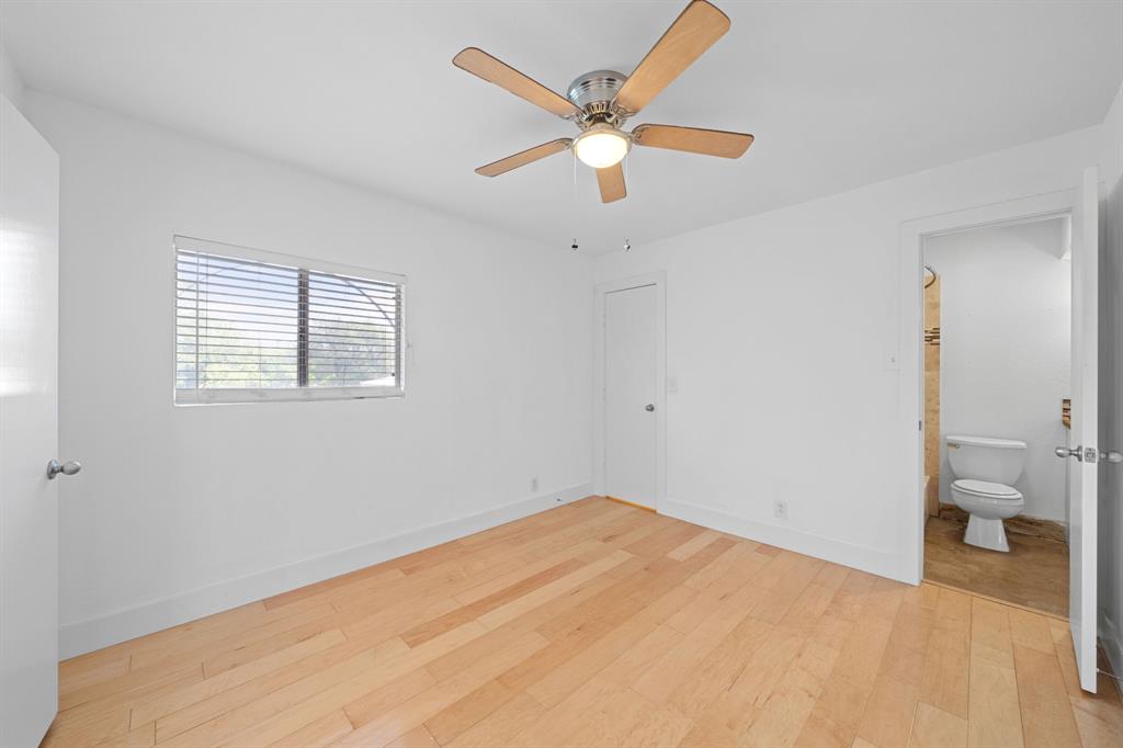 1313 East 52nd Street, Unit 105 Austin, TX 78723 - Photo 11 of 16 a view of empty room with wooden floor