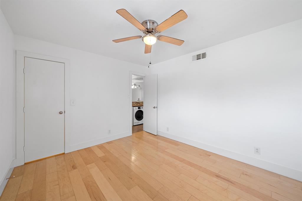 1313 East 52nd Street, Unit 105 Austin, TX 78723 - Photo 10 of 16 an empty room with closet and ceiling fan