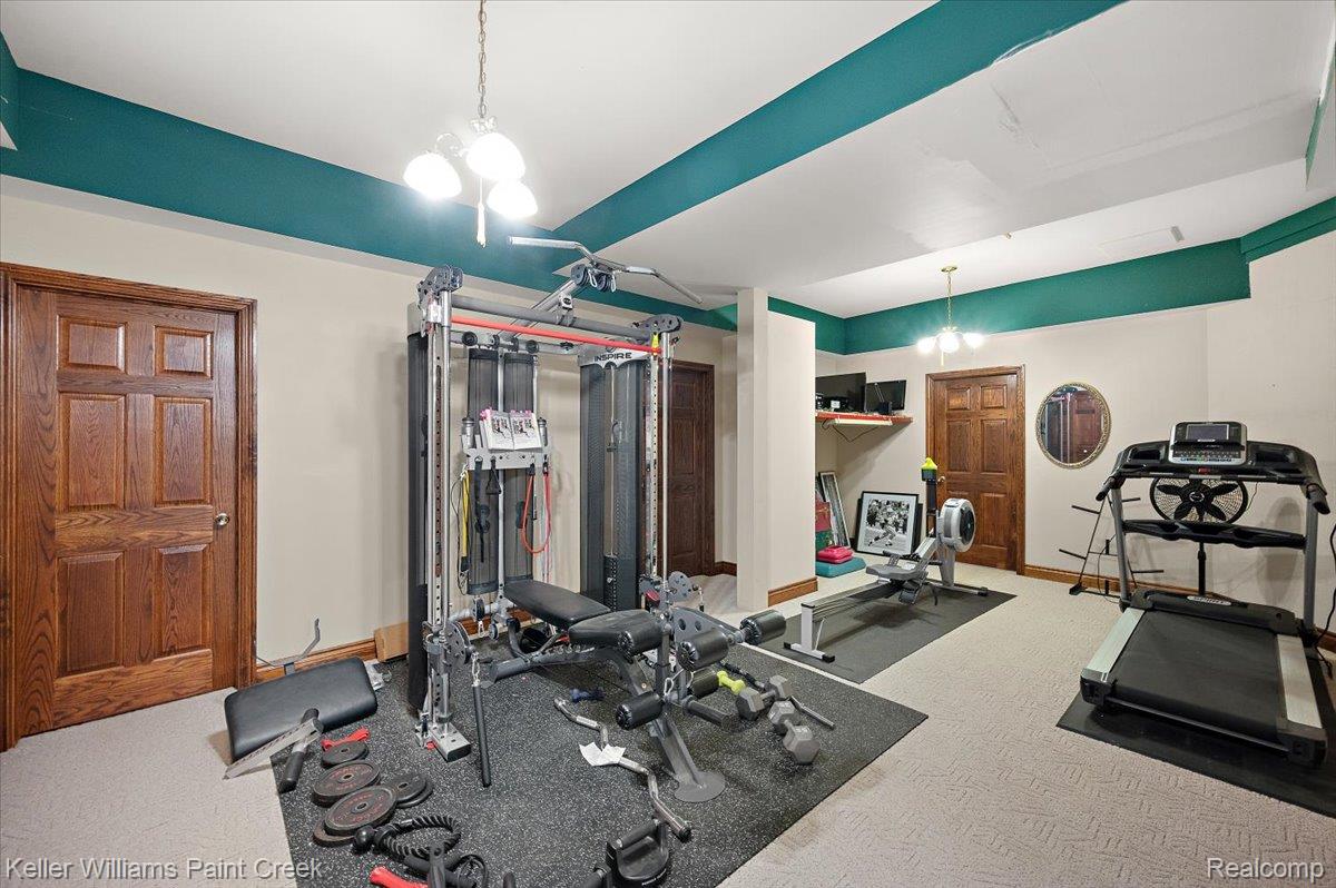 69069 Campground Road Romeo, MI 48065 - Photo 66 of 78 Spacious room featuring neutral wall tones, decorative ceiling trim, a ceiling fan, and recessed lighting