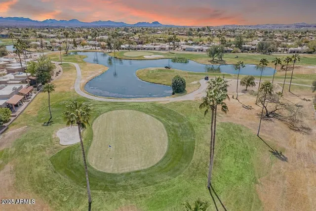 a view of a lake with a building in the background