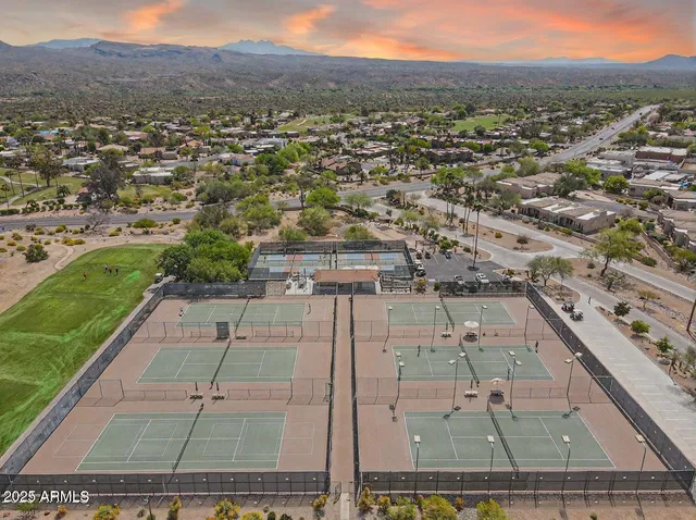 an aerial view of a residential houses and outdoor space