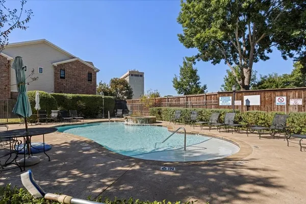 a view of a swimming pool with a patio