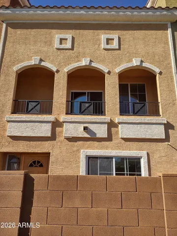 a front view of a building with a lots of windows