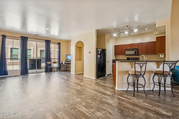 a kitchen with stainless steel appliances granite countertop a sink stove and cabinets