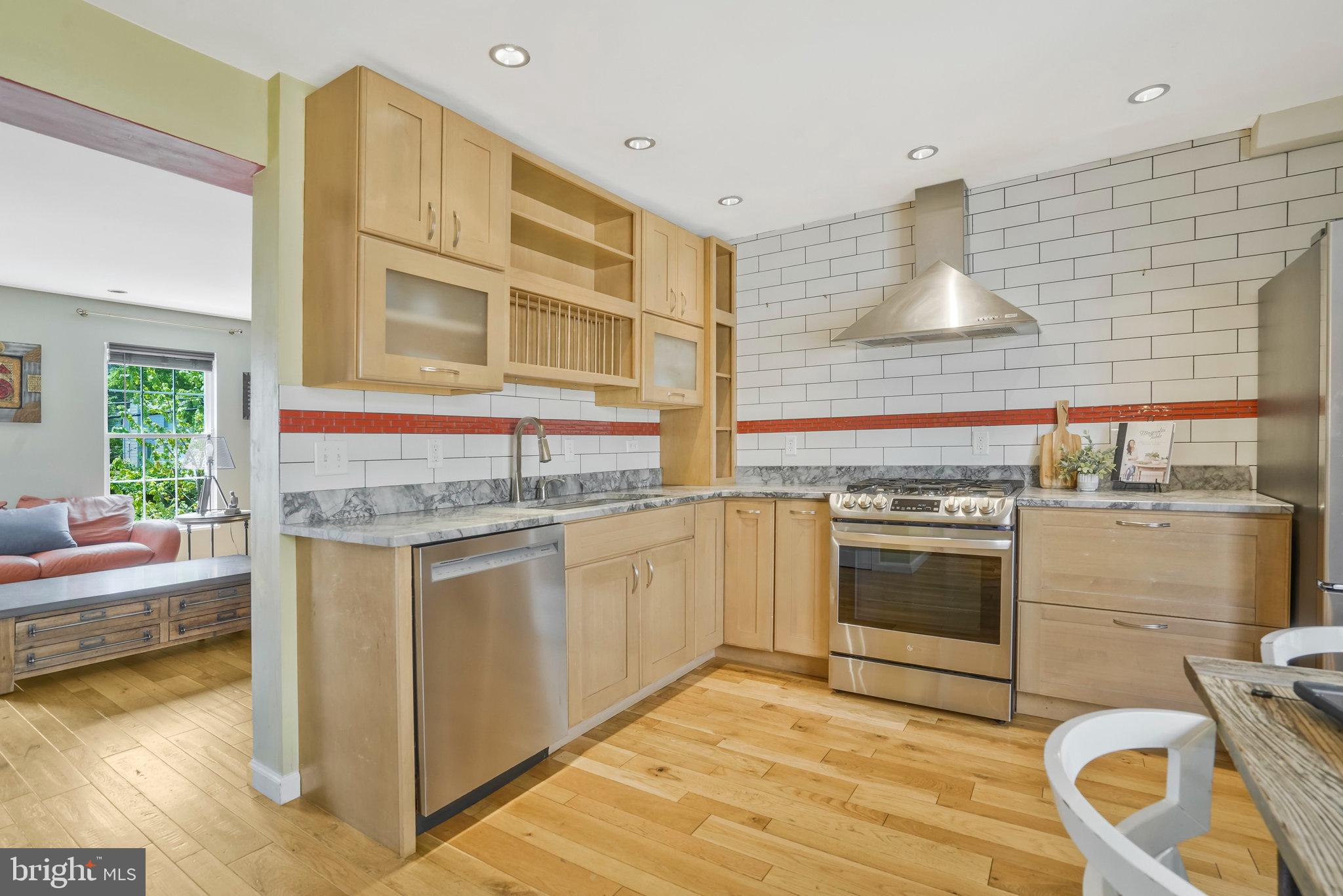 2181 Shirlington Road Arlington, VA 22206 - Photo 10 of 48 a kitchen with stainless steel appliances granite countertop a stove and a sink