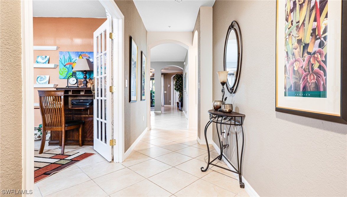 14801 Reflection Key Circle, Unit 212 Fort Myers, FL 33907 - Photo 2 of 33 a view of a kitchen with a refrigerator and a stove top oven