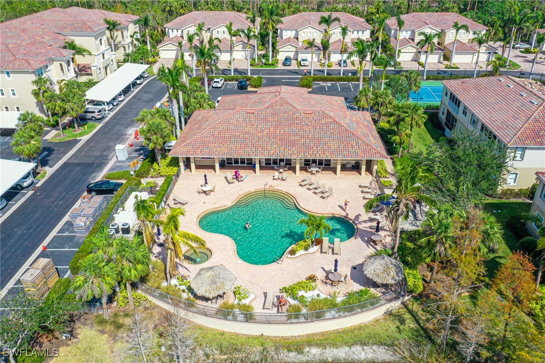 14801 Reflection Key Circle, Unit 212 Fort Myers, FL 33907 - Photo 29 of 33 a aerial view of a house with a yard and lake view