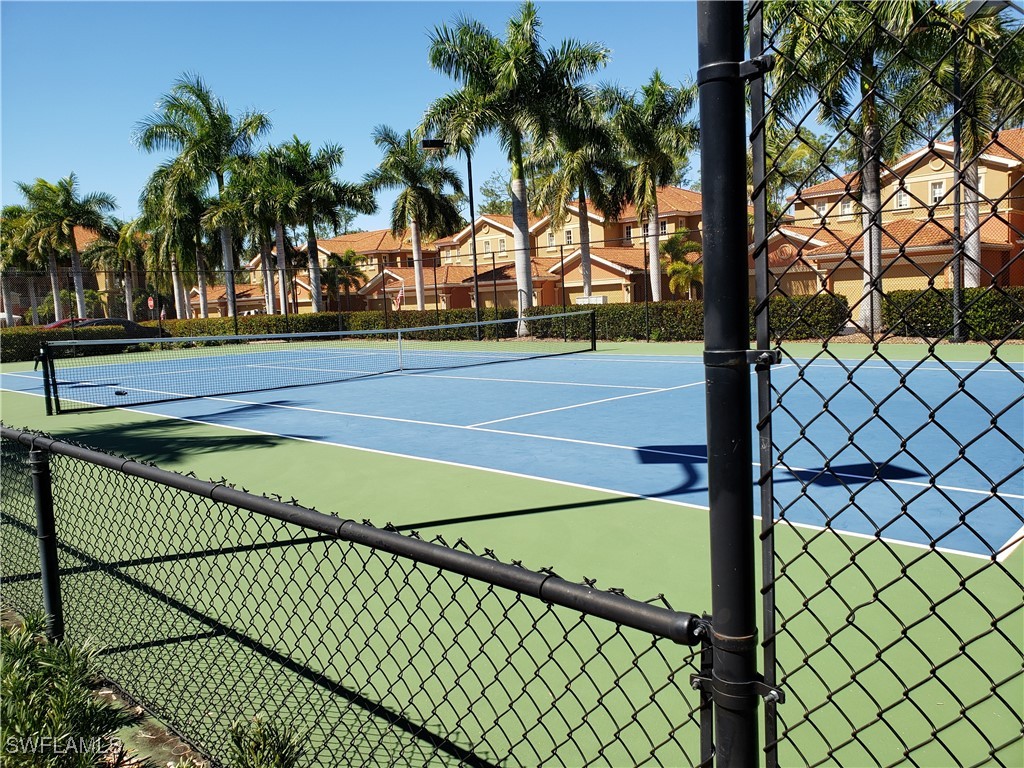 14801 Reflection Key Circle, Unit 212 Fort Myers, FL 33907 - Photo 31 of 33 a view of swimming pool with trees