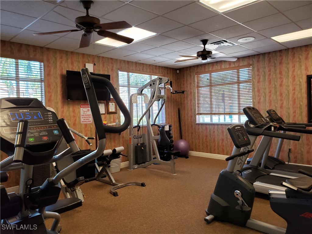 14801 Reflection Key Circle, Unit 212 Fort Myers, FL 33907 - Photo 32 of 33 a view of a room with gym equipment