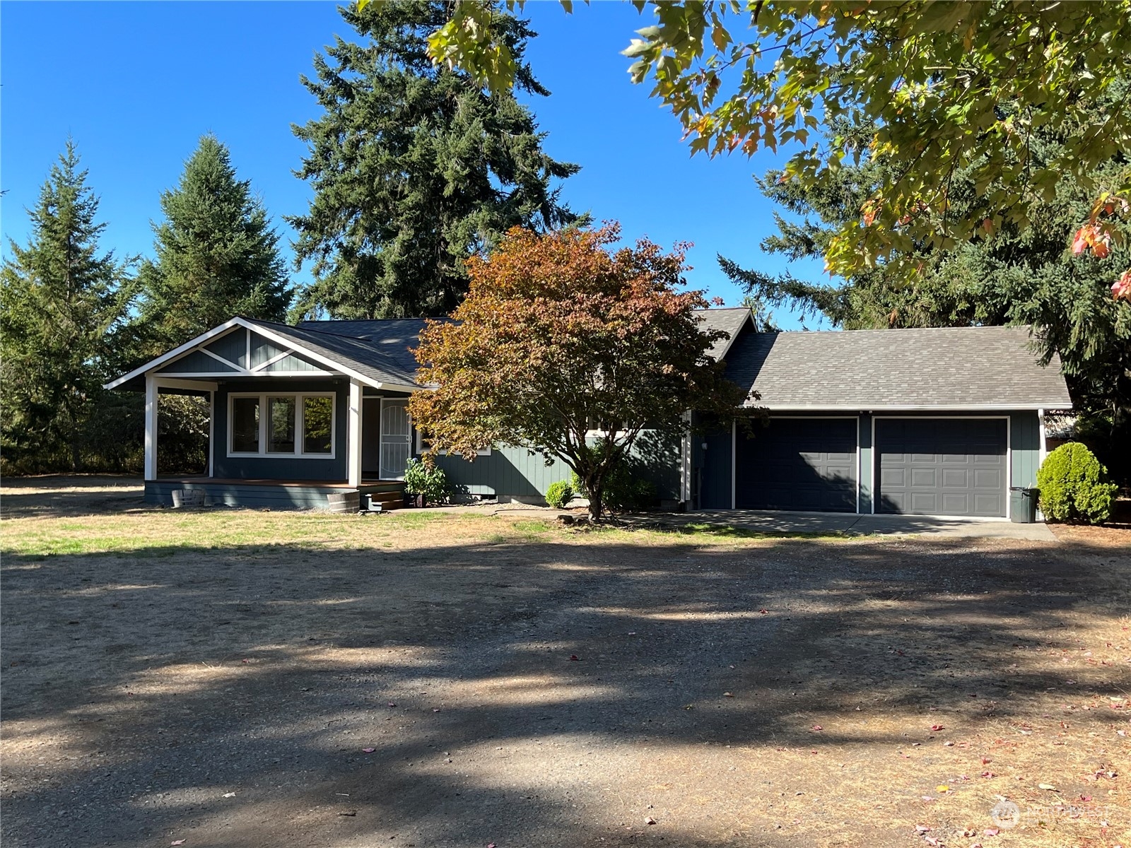 16635 Case Road Southwest Rochester, WA 98579 - Photo 2 of 35 a front view of a house with a garden