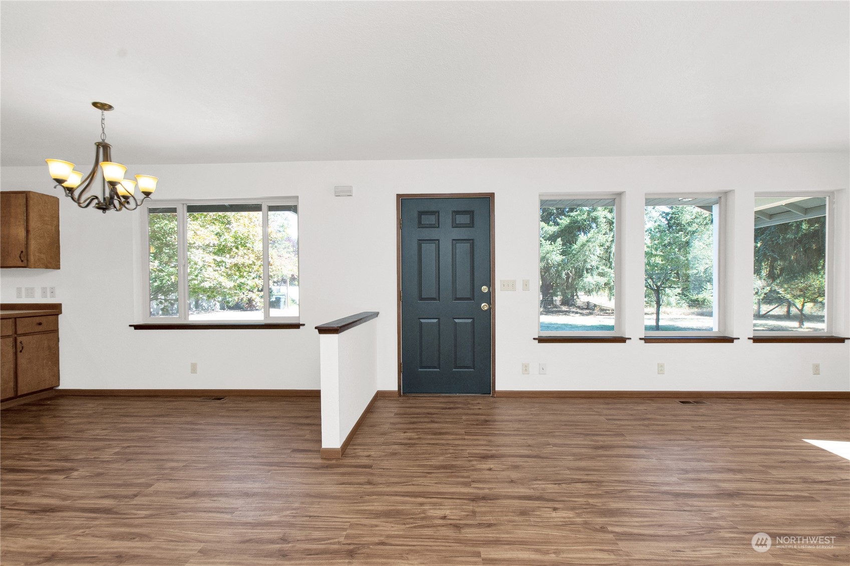 16635 Case Road Southwest Rochester, WA 98579 - Photo 22 of 35 a view of an empty room with wooden floor and a window