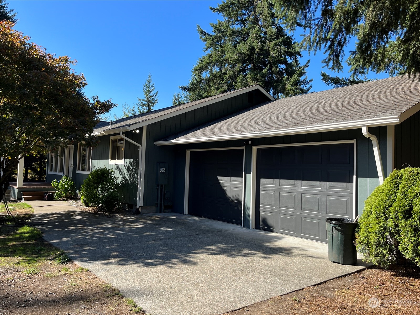 16635 Case Road Southwest Rochester, WA 98579 - Photo 3 of 35 a front view of a house with a yard and garage