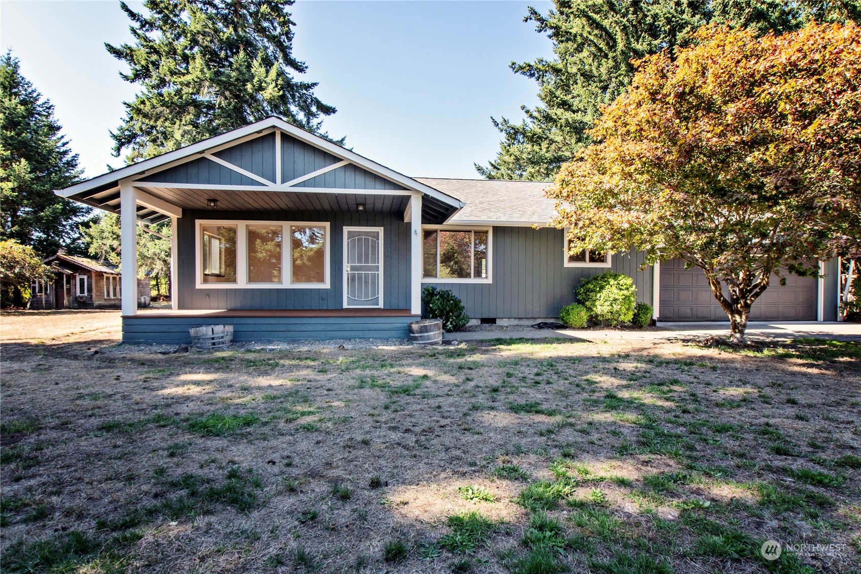16635 Case Road Southwest Rochester, WA 98579 - Photo 4 of 35 a front view of a house with a yard and garage