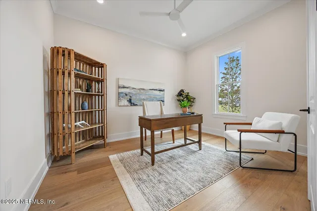 an aerial view of a house with a yard and lake view