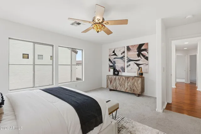 a bed room with a bed and a chandelier