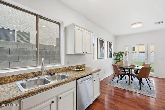 a kitchen with sink cabinets and microwave