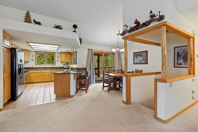 a living room with furniture and a dining table