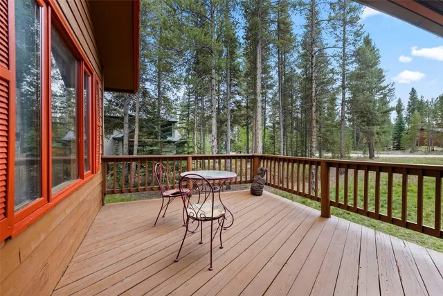 a view of balcony with wooden floor and outdoor seating