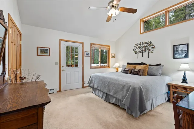 a spacious bedroom with a bed and a table