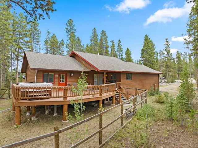 an aerial view of a house with swimming pool and sitting area