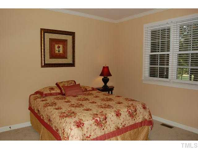 5100 Salem Ridge Road Holly Springs, NC 27540 - Photo 15 of 25 Visiting family and friends will enjoy having their own first floor bedroom and updated full bath. Bedroom
