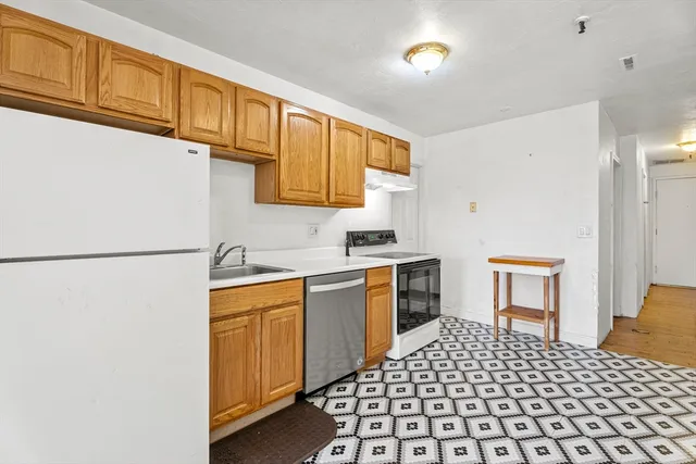 a kitchen with a cabinets and appliances