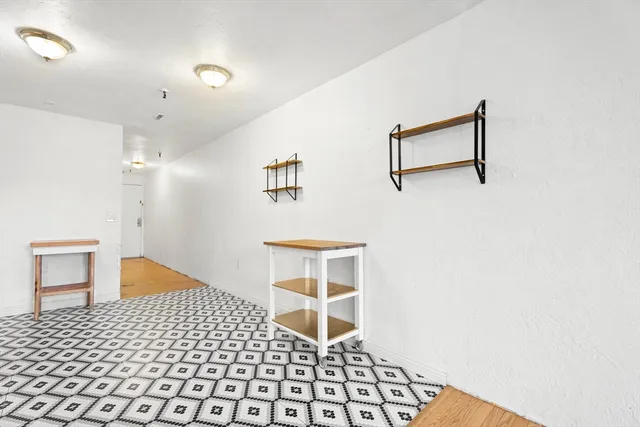 a room with a door and a rug