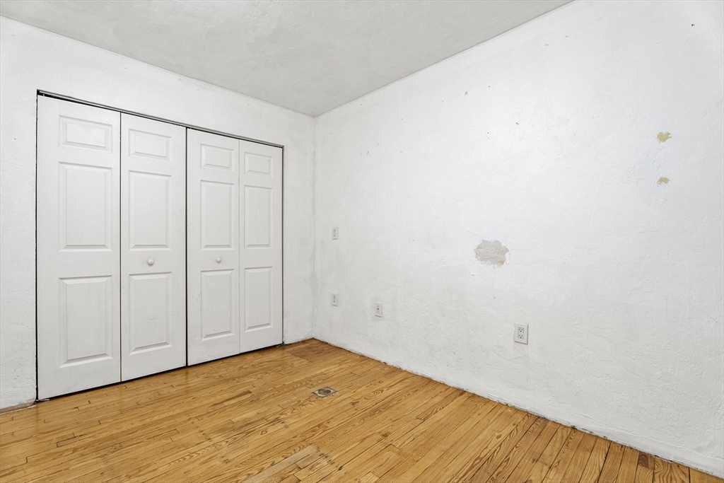 531 Main Street, Unit 403M Worcester, MA 01608 - Photo 31 of 39 a view of empty room with wooden floor