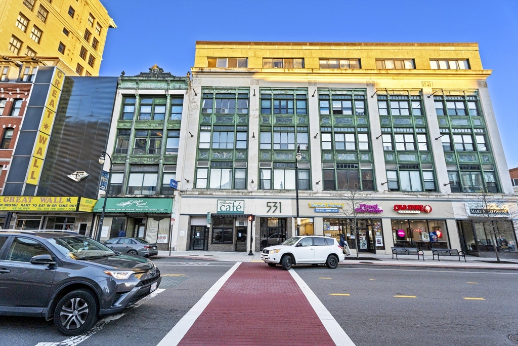 531 Main Street, Unit 403M Worcester, MA 01608 - Photo 36 of 39 a view of building with cars parked