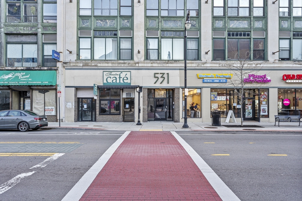 531 Main Street, Unit 403M Worcester, MA 01608 - Photo 37 of 39 a front view of multi story building with retail shops